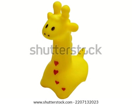 Giraffe rubber toy isolated on white background. Children's toy. 