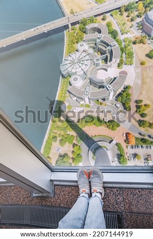View from the observation deck of the Tv Tower in Dusseldorf. Legs are shaking from fear of heights.