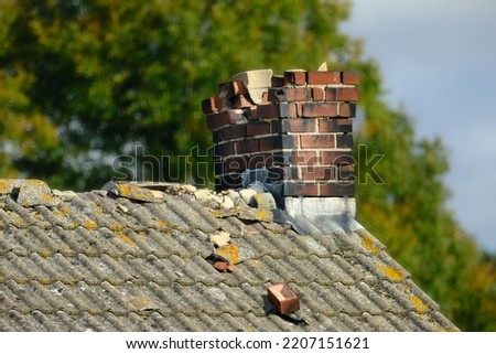 Damaged Chimney on a building Royalty-Free Stock Photo #2207151621