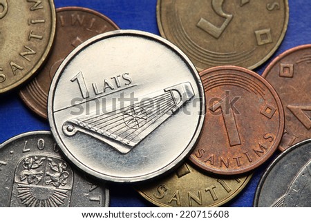 Coins of Latvia. A kokle, a Latvian plucked string musical instrument, depicted in old Latvian one lats coin.  Royalty-Free Stock Photo #220715608
