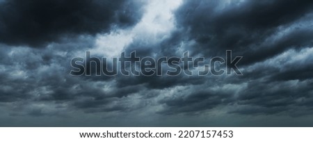 Dark clouds before a thunder-storm. Royalty-Free Stock Photo #2207157453