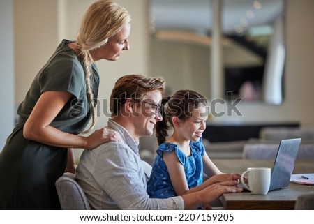Elearning, laptop and family help child with education teaching and digital knowledge at home table together. Father, mother and kid watch funny virtual class, online education website for e learning