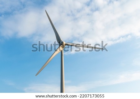 Close-up of windmills group with blue sky on the west coast of Taiwan.
