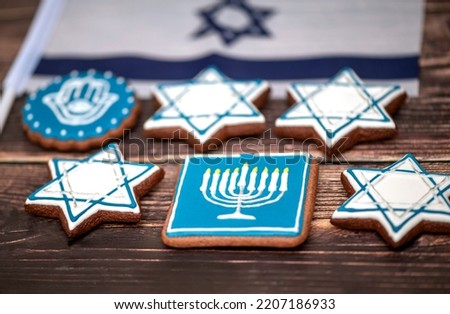Delicious festive Hanukkah cookies for celebrating on a wooden background. Closeup