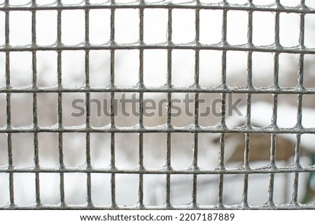 Ice fence. Winter landscape with snow.