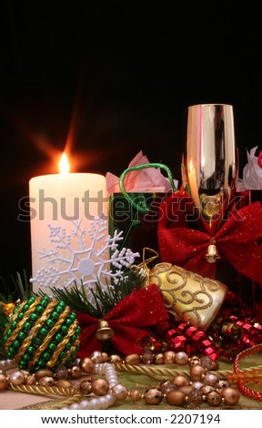 Christmas Ornaments and Candle on black Background