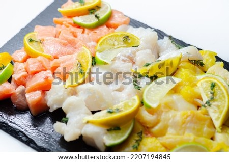 Fish pie mix, raw skinless and boneless cod, dyed smoked haddock and salmon, sea fishes