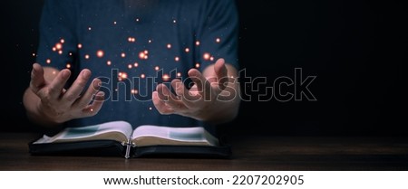 Holy Bible book with Praying hands with faith in religion and belief in god. Power of hope and devotion, banner copy space.