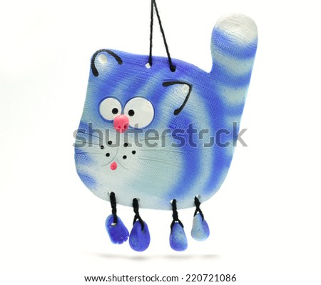 funny cartoon cat - clay souvenir isolated on white background