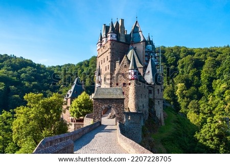 Eltz Castle or Burg Eltz is a medieval castle in the hills above the Moselle River near Koblenz in Germany Royalty-Free Stock Photo #2207228705