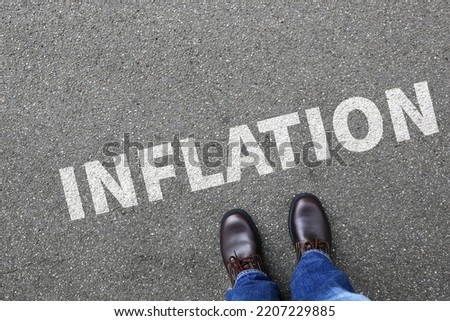 Inflation symbolic photo money finance and economic crisis economy business concept with businessman