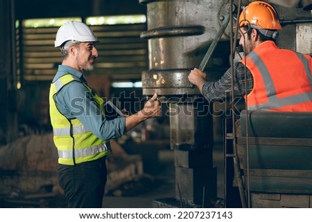 professional industrial engineers in hard hats. working at heavy industry manufacturing factory, man worker in an construction industrial job, maintenance service check for safety first concept
