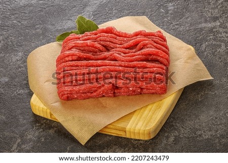 Raw beef minced meat over board for cooking