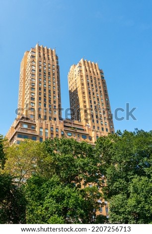 Towering towers of the Majestic apartments above the green trees of Manhattan's central park Royalty-Free Stock Photo #2207256713