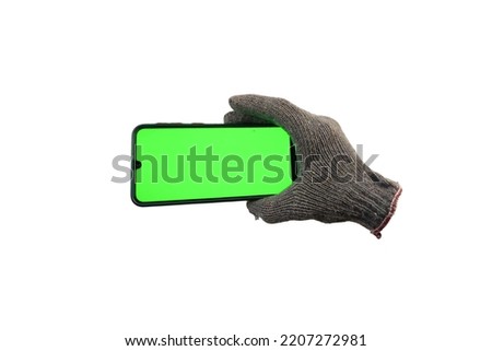 gloves holding smartphone. Smartphone Concept. Smartphone studio photo with green screen. isolated white background