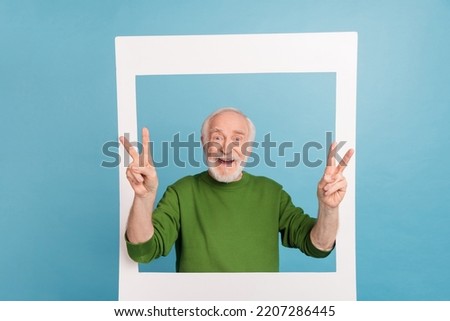 Portrait of crazy excited person two hands demonstrate v-sign hello greetings symbol isolated on blue color background