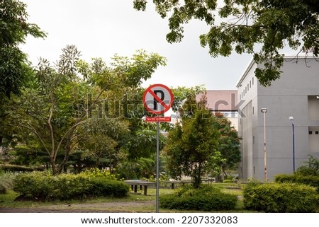 
the traffic sign letter P is crossed out and the information below it is 50 meters indicating that vehicles are prohibited from parking 50 meters from the right and left of the symbol