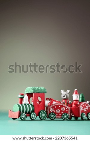 Red Christmas toy train. Christmas greeting card. Christmas background with copy space. Royalty-Free Stock Photo #2207365541