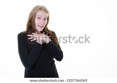 young woman hands on chest surprised face offended with long blond hair on white background