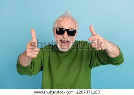 Portrait of cheerful overjoyed person point fingers camera you toothy smile isolated on blue color background