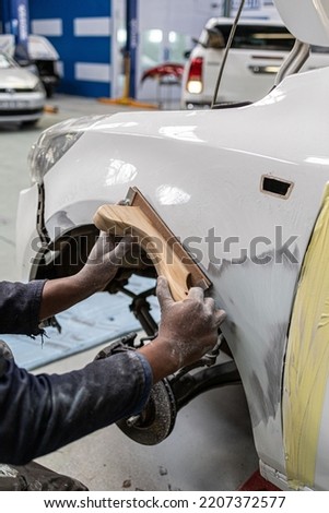panel beating automotive repair body work sanding block  Royalty-Free Stock Photo #2207372577