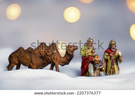 antique figures of the three kings with two camels, christmas picture