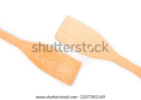 Wooden spatulas for comfortable turning food while cooking. Royalty-Free Stock Photo #2207385169