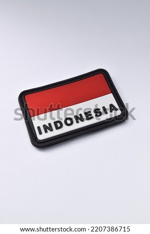Indonesian flag patch isolated on white background. Can be detached. Red and white flag