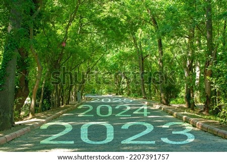 New start of the new year 2023. Starting to new year. 2023 written on the road	 Royalty-Free Stock Photo #2207391757