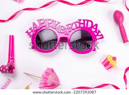  white background with glasses, balloons and tubes for birthday or party celebration, birthday, anniversary concept in pink colors or for a girl, congratulations. 