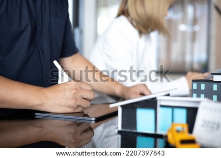 Architect concept, Male architects working with on tablet in the office.