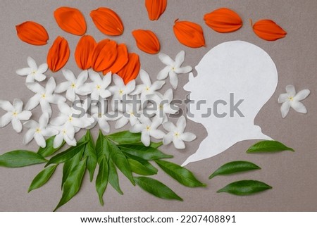 Mahatma Gandhi Jayanti, independence, and republic day Celebration event tricolor concept. paper cut gandhiji silhouette with floral background. Royalty-Free Stock Photo #2207408891