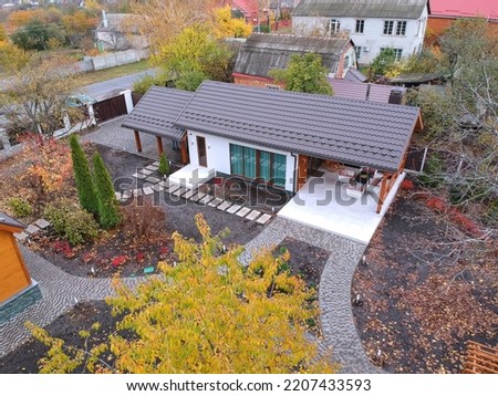 modern country house in the village in autumn top view