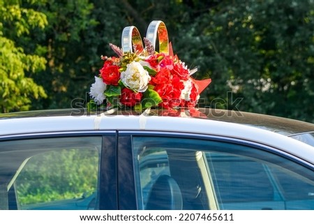Decoration of the wedding car of the bride and groom.