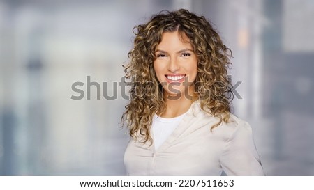 Young business woman with a friendly expression