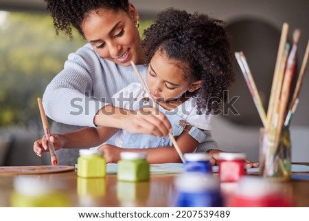 Art education, mother and child painting for an art preschool project with a young mom helping her daughter at home. Kindergarten, love and creative painter with brush teaching and drawing with girl