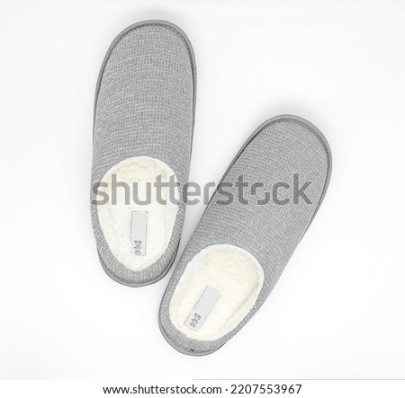 Topview of gray home slippers isolated on white background. Warm domestic sandal. Bed shoes accessory footwear.
