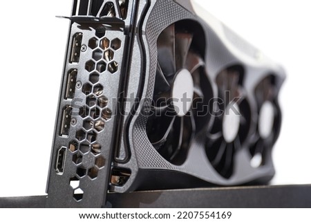 High end graphics card computer hardware upgrade on a desk. Expensive GPU hardware component Royalty-Free Stock Photo #2207554169