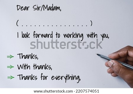 A person's decision making moment of ending letter with thank you on white background. Royalty-Free Stock Photo #2207574051