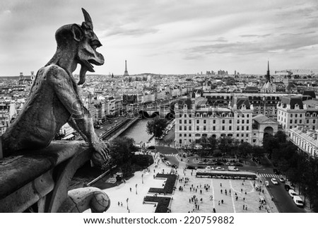 Gargoyle Statue in Notre Dame Cathedral and Paris aerial cityscape with Eiffel Tower on background. Paris, France 