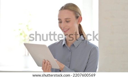Portrait of Woman using Digital Tablet
