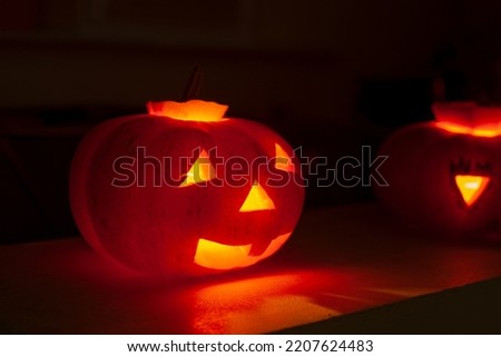 The lighting pumpkin in the darkness.