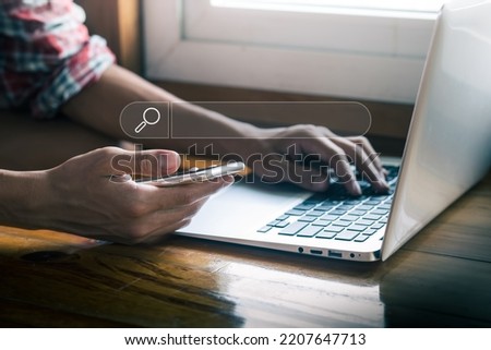 Businessman searching information data on internet networking concept, Hand of man typing text on laptop keyboard.