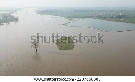 Aerial view of high water in the river Dikes and breakwaters above the waterline