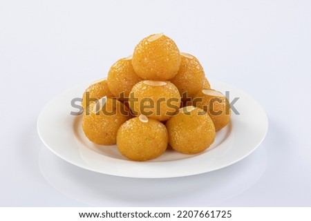 Indian Sweet Motichoor laddoo Also Know as Bundi Laddu or Motichur Laddoo Are Made of Very Small Gram Flour Balls or Boondis Which Are Deep Fried. Isolated On white background. Royalty-Free Stock Photo #2207661725