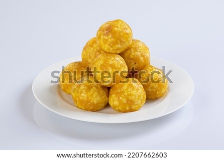 Indian Sweet Motichoor laddoo Also Know as Bundi Laddu or Motichur Laddoo Are Made of Very Small Gram Flour Balls or Boondis Which Are Deep Fried.Isolated on white background  Royalty-Free Stock Photo #2207662603