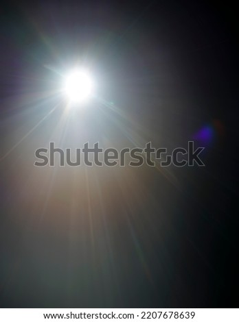 Sun rays light isolated on black background for overlay design. abstract colorful rays of light on black backdrop. Lens Flare light over Black Background. overlay or screen filter over Photos