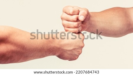 Two hands, isolated arm. Hands of man people fist bump team teamwork, success. Man giving fist bump.