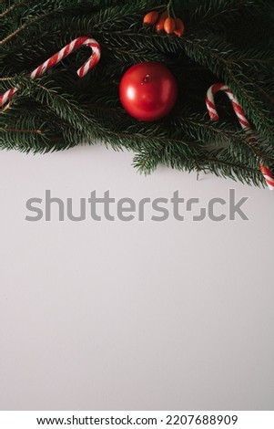 A green Christmas tree decorated with sweet children's lollipops