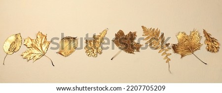 Creative autumn composition flat lay on seasonal background with golden maple leaves,minimal autumn concept,screen banner.Happy Thanksgiving and greeting card